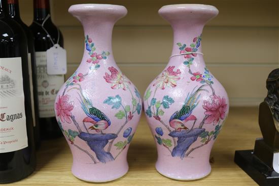 A pair of Chinese pink sgraffito ground famille rose vases